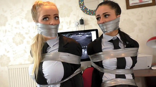 2 employees tied up in an office for fun